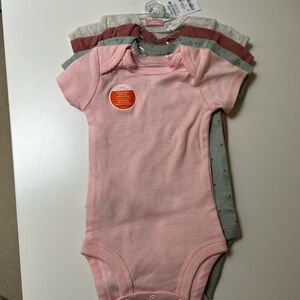 Carter’s Newborn Ribbed Bodysuits 4-Pack